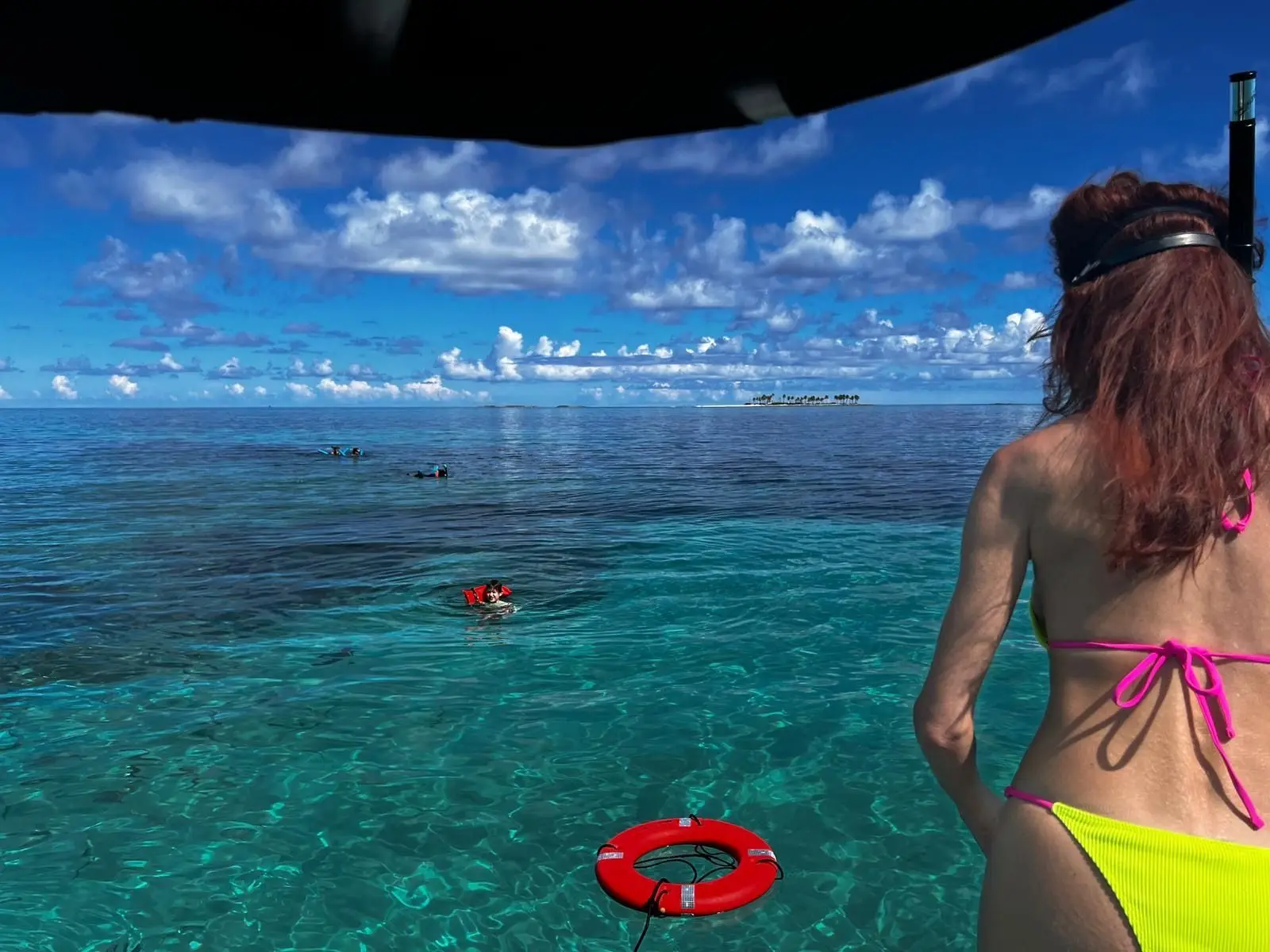 Beach day experience with water toys and snorkeling near Rose Island