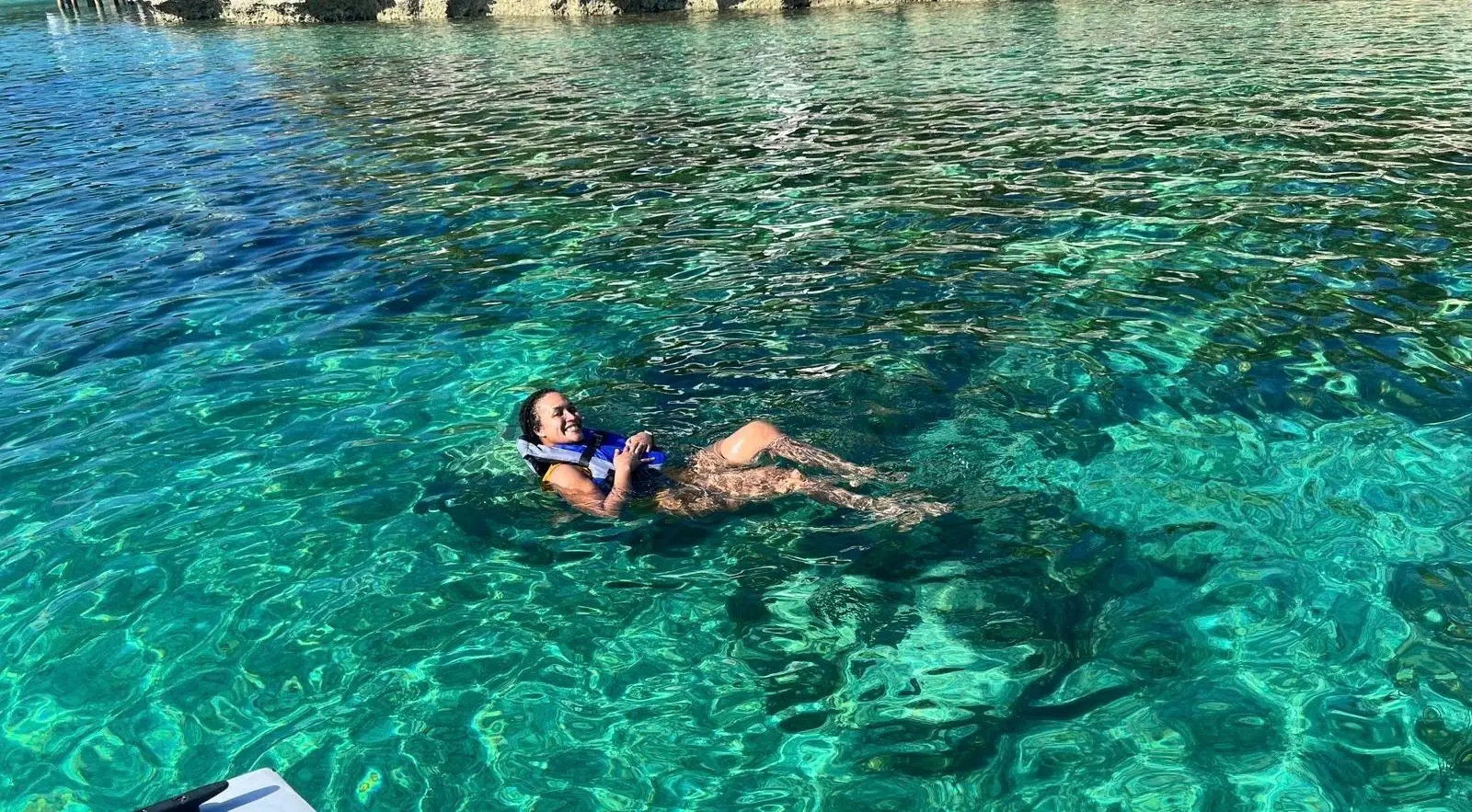 Beach day experience with water toys and snorkeling near Rose Island