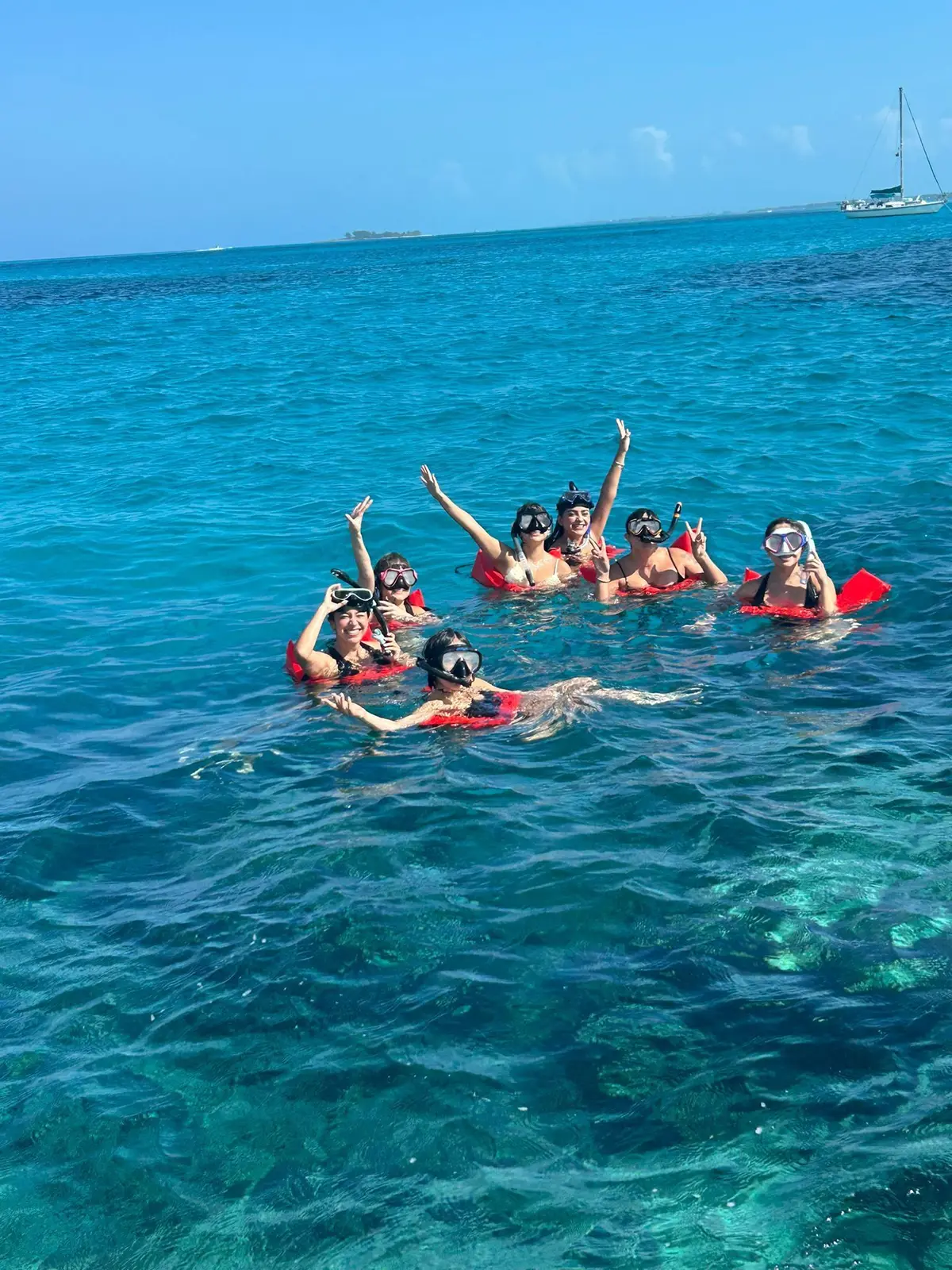 Beach day experience with water toys and snorkeling near Rose Island