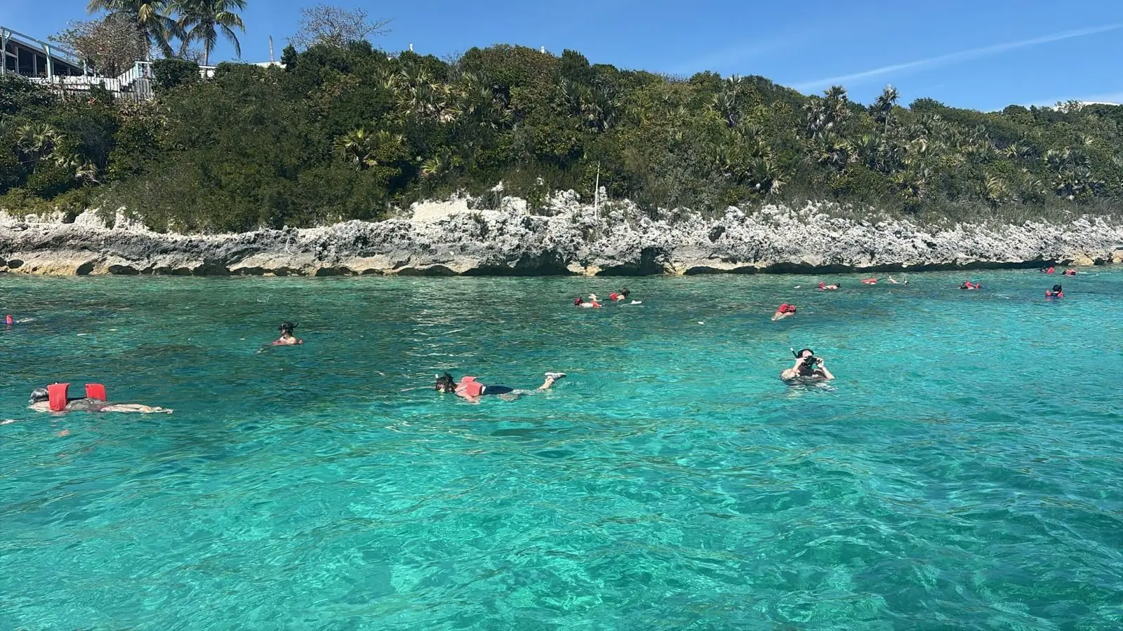 Beach day experience with water toys and snorkeling near Rose Island