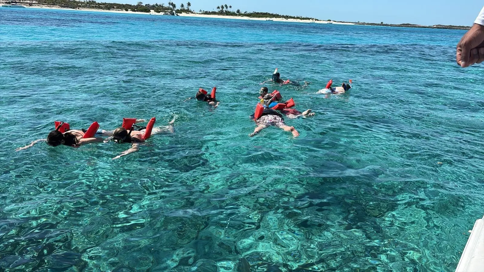 Beach day experience with water toys and snorkeling near Rose Island